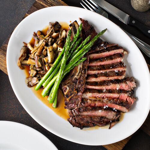 Sirloin Steaks With Mushroom and Leafy Green Sauté