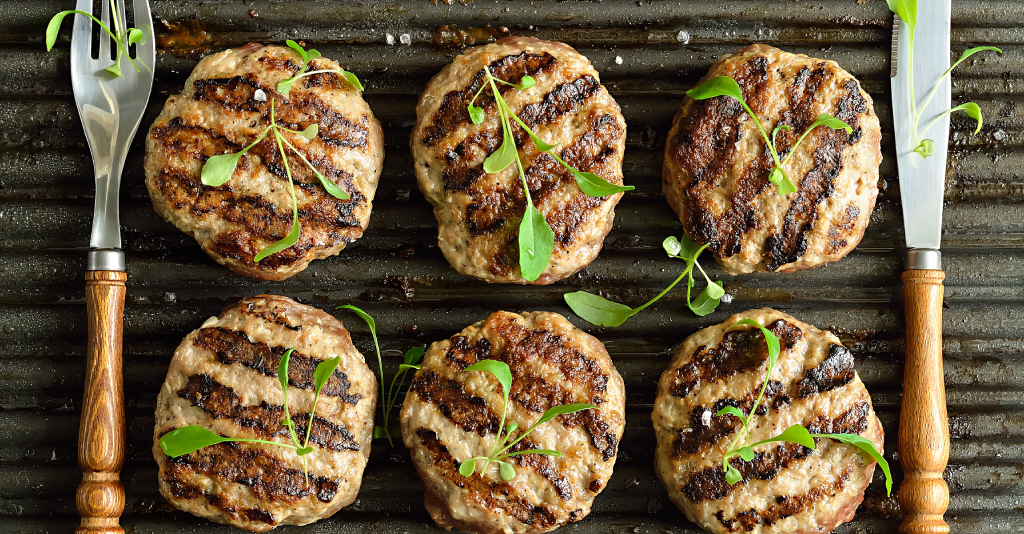 pork burgers on the grill