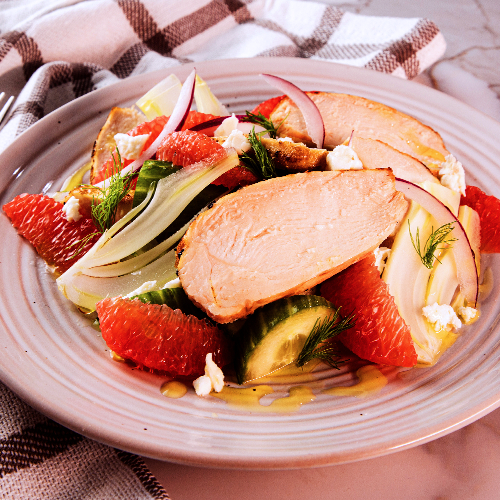 sliced organic chicken breast with grapefruit salad